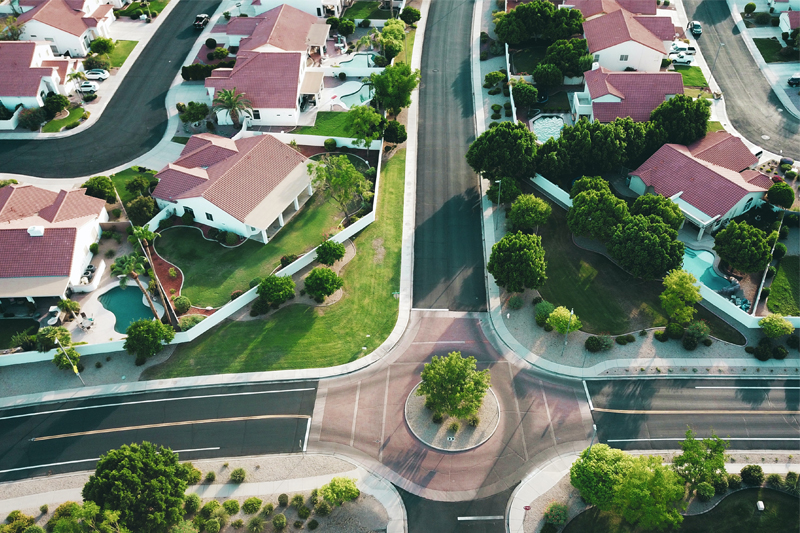 How can financial statements help real estate firms decide whether to expand their portfolios?